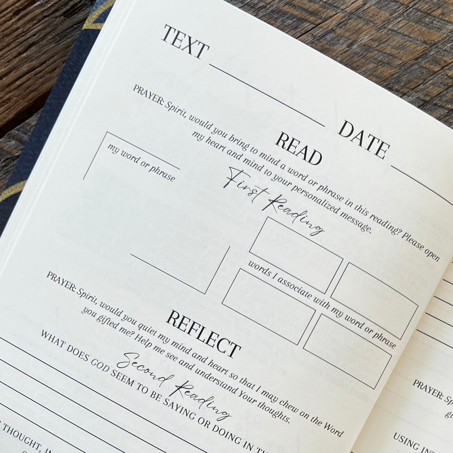 A book is on the table for a man or woman to do a devotional and bible reading and praying for spiritual encouragement.